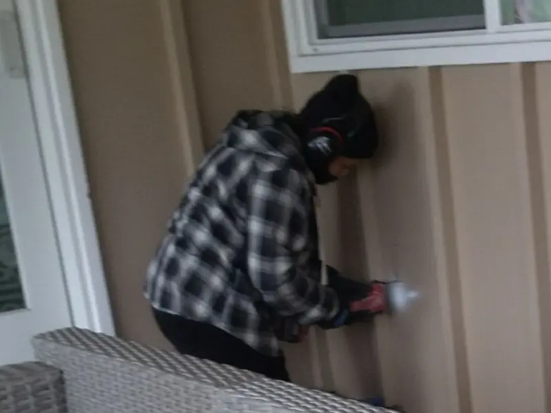 Professional electrician installing an exterior outlet in Valley